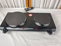 Front view of Elite Gourmet double burner range showing both heating elements, indicator lights, knobs and cord