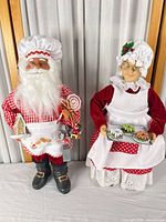 Full view of both Santa and Mrs. Claus figurines standing side by side