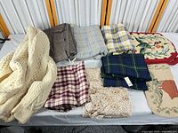 Overview of cable knit jacket, seven fabric pieces, two hooked panels