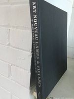 Spine and front board of book showing title and cloth cover