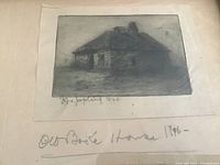 Close view of cottage etching, signature visible