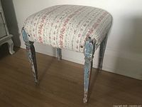 Full view of stool showing upholstery and legs