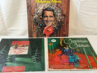 All three LPs laid out showing front covers