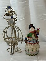 Both figurines side by side showing full forms