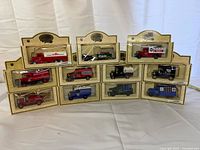 Front view of all 11 boxed die-cast trucks