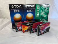 All sealed VHS and audio cassettes grouped to show front packaging