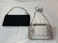 Both handbags side by side showing overall size, color, and chain straps