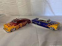 Both diecast cars angled side view