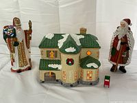 Full view of house, both Santa figurines, and mailbox
