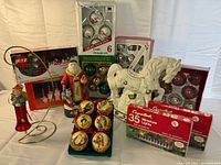 Group shot of all items including ornaments, figurines, rocking horse and light sets