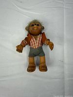 Front view of Steiff Mecki doll showing clothing and features