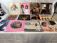 All 12 records laid out showing front covers