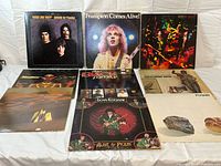 Group shot of all nine LPs laid out in two rows