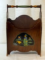 Full view of magazine rack front, showing handle and painted panel