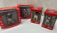 All four boxed dog ornaments front view