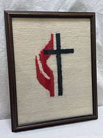 Full view of framed needlepoint artwork