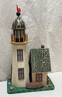 Front view showing lighthouse, cottage and base details