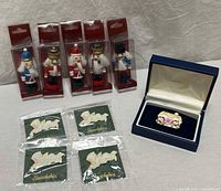 Group shot of all 10 holiday pins and brooches