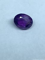 Top view of oval faceted purple amethyst