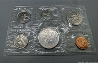 Front view of sealed 1973 Canadian PL coin set showing reverse designs