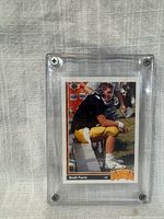 Front view of card in screw-down case showing Brett Favre image and Rookie emblem