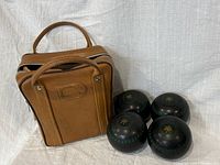 Bag standing with four bowls beside