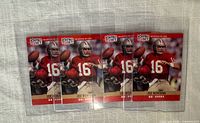 Front view of all four Joe Montana cards in top loaders
