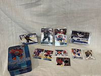 Overall lot with tin, sealed packs, jersey card and loose cards