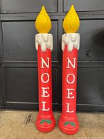 Front view of both blow mold candles showing NOEL lettering