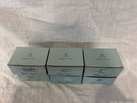 Front view three of the six Partylite candle boxes