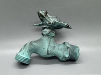 Side view of brass hose bib showing frog handle and hose threads