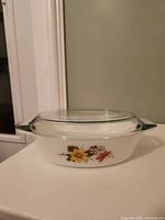 Side view showing floral pattern and lid