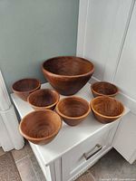 Full set with large and six small teak bowls