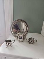 Full view of all four E.P.N.S. pieces