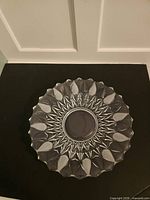 Top view showing full starburst cut pattern and scalloped rim