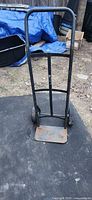 Front view of metal hand truck showing frame and toe plate