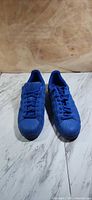 Pair of Adidas Superstar J Triple Blue sneakers front view