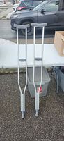 Front view of both aluminum crutches showing full length and condition
