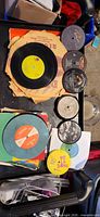 Top view of assorted 12-inch and 7-inch records on tray