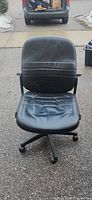 Front view of black armless office chair