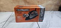 Front of boxed Proctor Silex Durable Iron