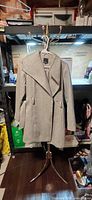 Front view of grey herringbone Reitmans women’s coat on stand