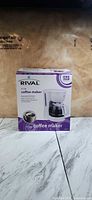 Front of boxed Rival 5-cup coffee maker