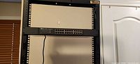 Front view of TP-Link TL-SG1024D switch mounted in rack