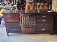 Front view of entire dresser showing drawers and cabinet