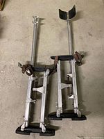 Full view of both aluminum drywall stilts