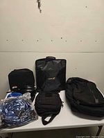 All items on table: backpack, Mobi case, AirHawk case with cushion parts, tactical pouch