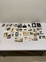 Wide shot of entire lot of vintage photographs spread on table