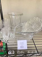 Beaded platter, bowl, vase, tumblers and cut crystal bowl collected on shelf