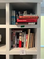 Upper shelf with stacked WWII and memoir titles